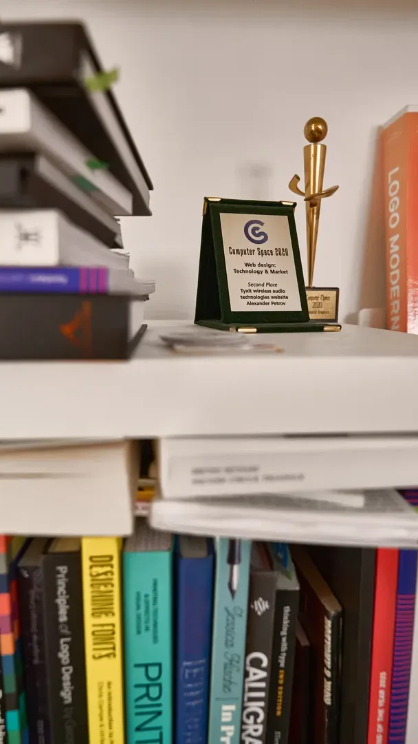 A shelf of type books and a Computer Space 2025 award